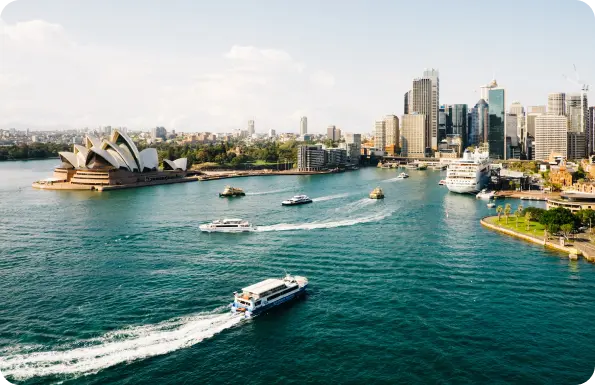 A breathtaking view of the Sydney Opera House and the city skyline, showcasing the iconic architectural masterpiece and urban landscape