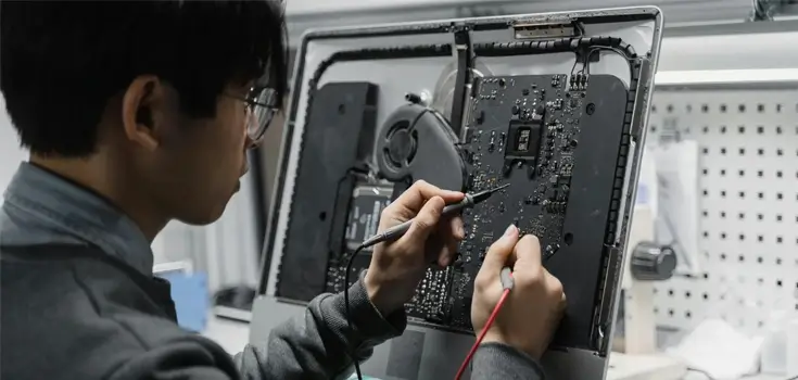 a person repairing technology