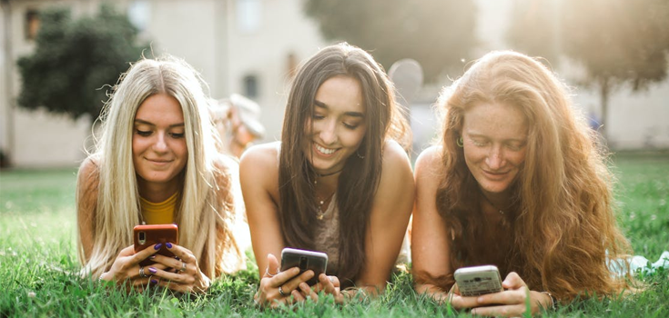 Group of friends using phone