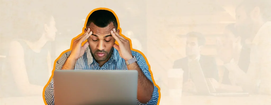 stressed man with laptop