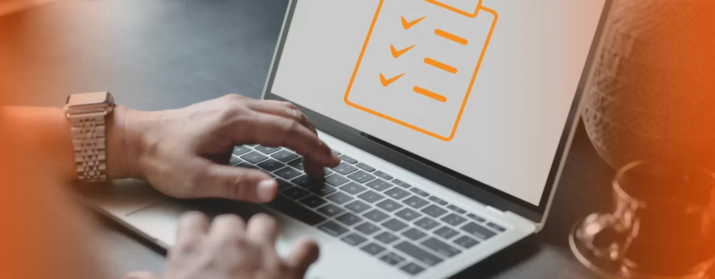 man using laptop with checklist on screen