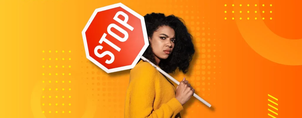 A content moderator holding a stop sign to depict the role of moderation in curing excessive social media usage