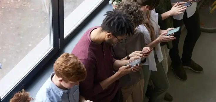 group of people using phone